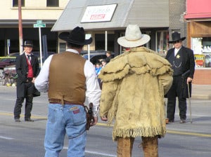 Cowboy re-enactment group the Dog Creek Gunfighters square off for a staged fight in downtown Alva.