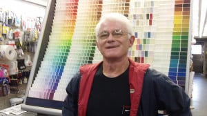Don stands in front of colorful paint samples.
