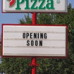 Sign says, "Opening Soon"