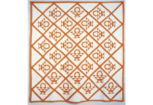 Quilt with repeating basket design