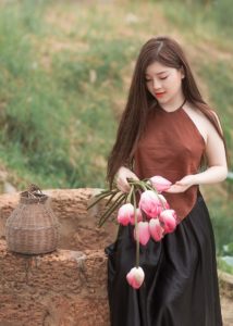 Woman with basket and tulips