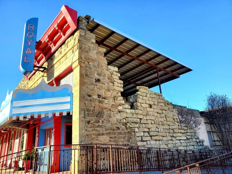 Archer City, Texas, Royal Theater, side view facade and roofless building behind