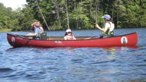 Three kids in a canoe