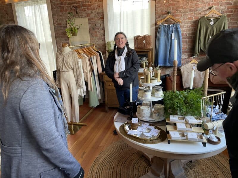 A few people shopping in an attractive retail store in a former railroad depot.